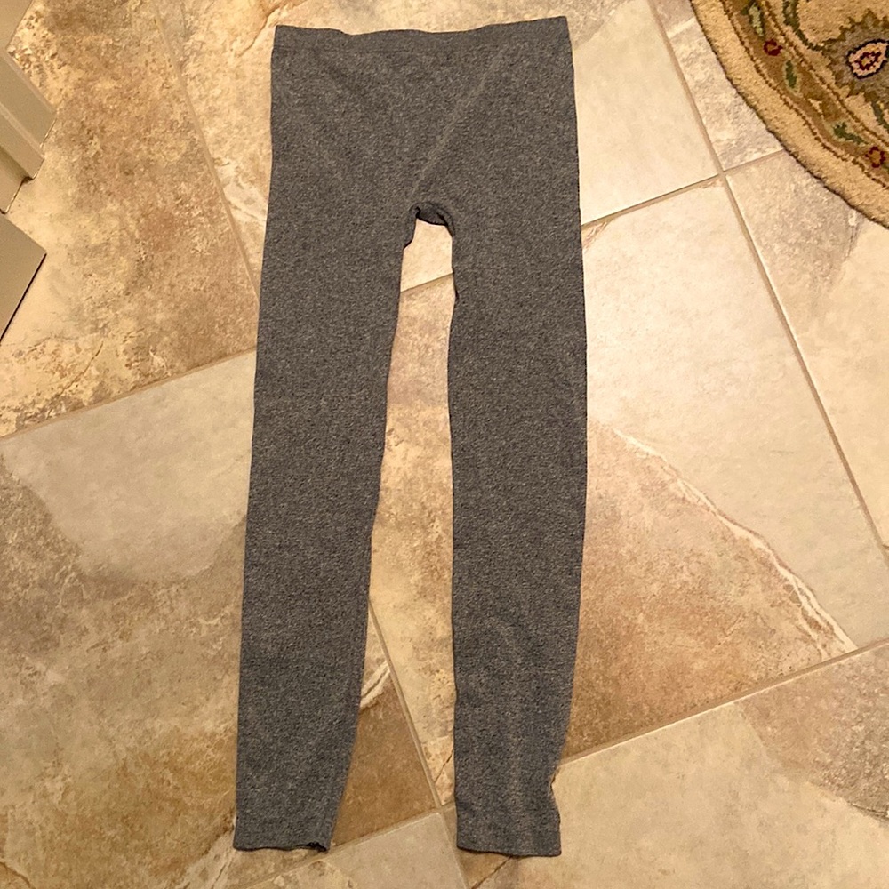 Never worn bebe tights size M/L. Made in USA. 92% nylon, 8% spandex. Perfect.